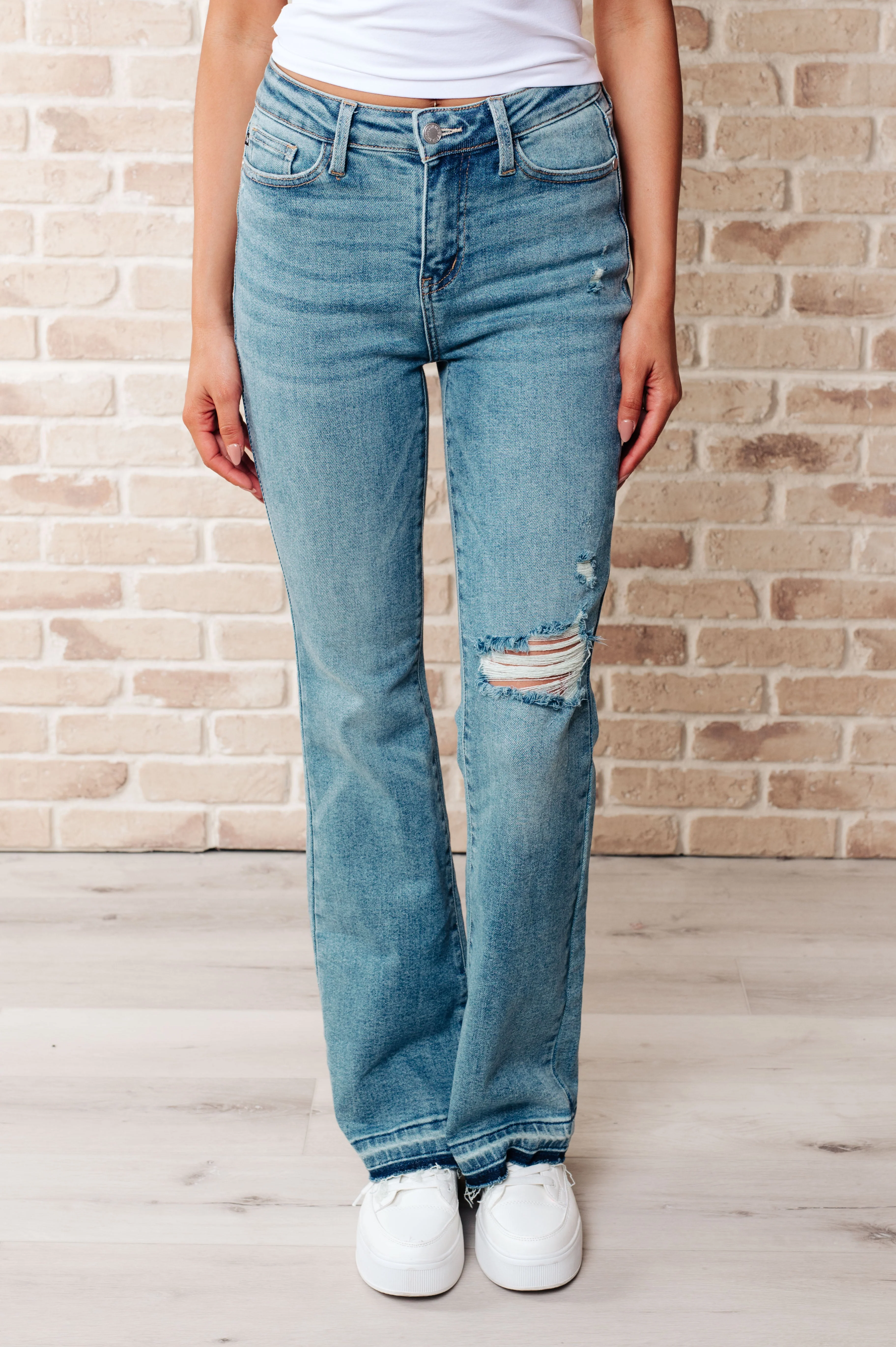 JUDY BLUE Isla Mid Rise Distressed Released Hem Bootcut Jeans - Makeswep